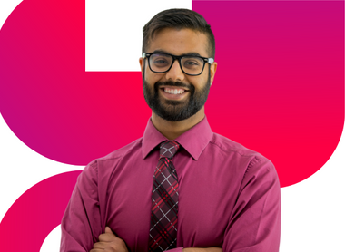 Professional Man smiling with his arms crossed in front of red gradient shapes - CICM Training