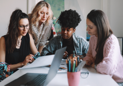 Young professional People crowded around a table